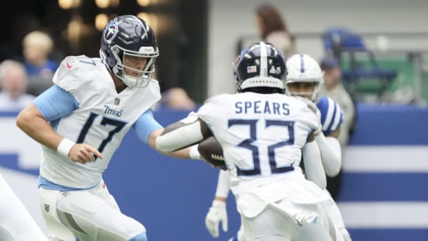 Tennessee Titans quarterback Ryan Tannehill (17) hands the ball to Tennessee Titans running back Tyjae Spears (32) on Sunday, Oct. 8, 2023, during a game against the Tennessee Titans at Lucas Oil Stadium. 